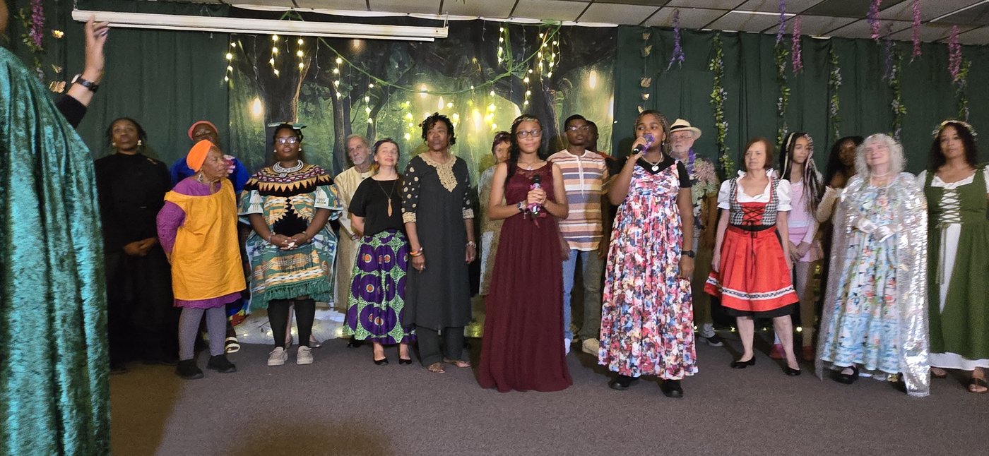 Performers singing on stage at a past celebration